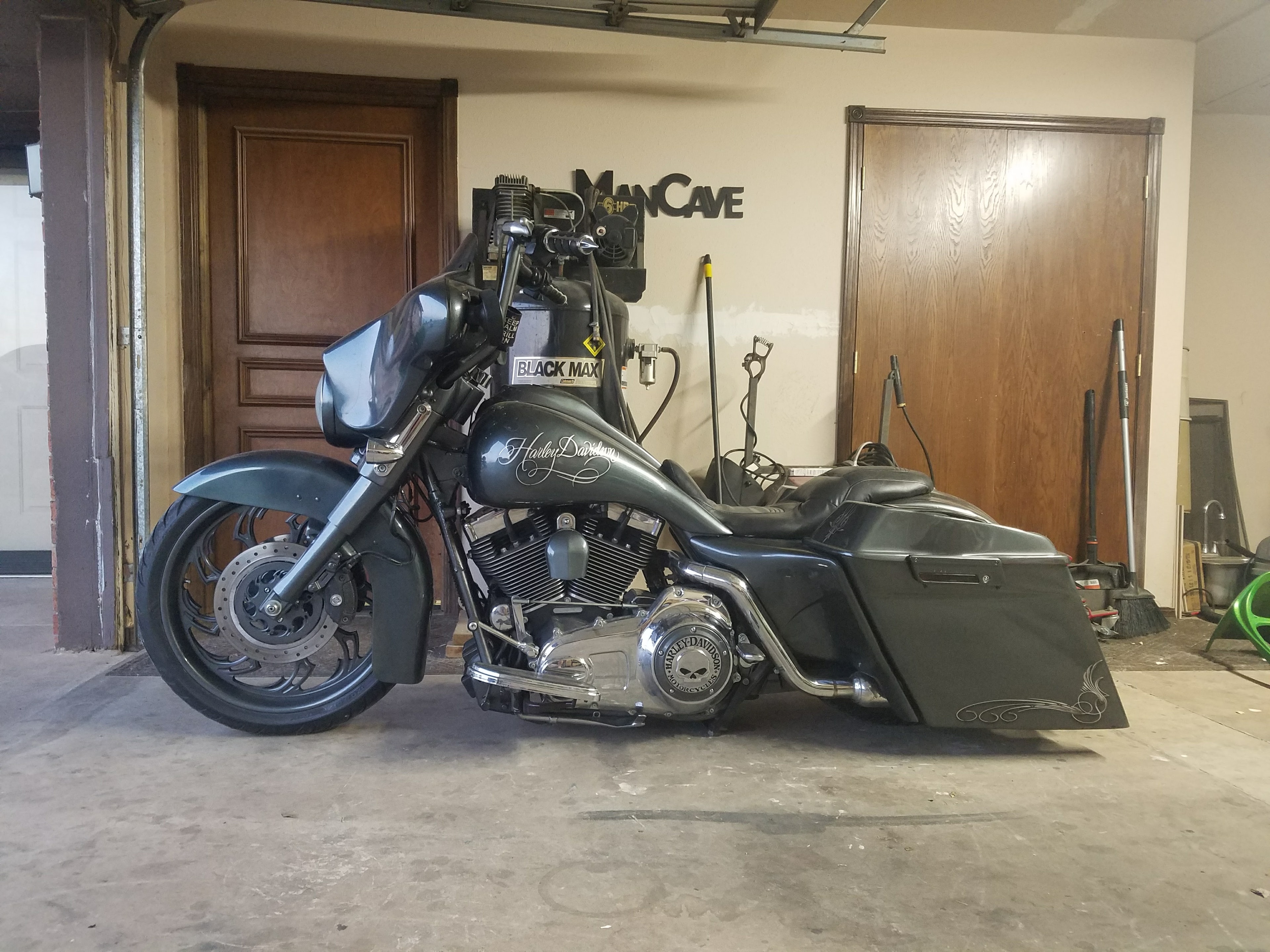 Custom Harley-Davidson bagger — charcoal gray with pinstripe detail