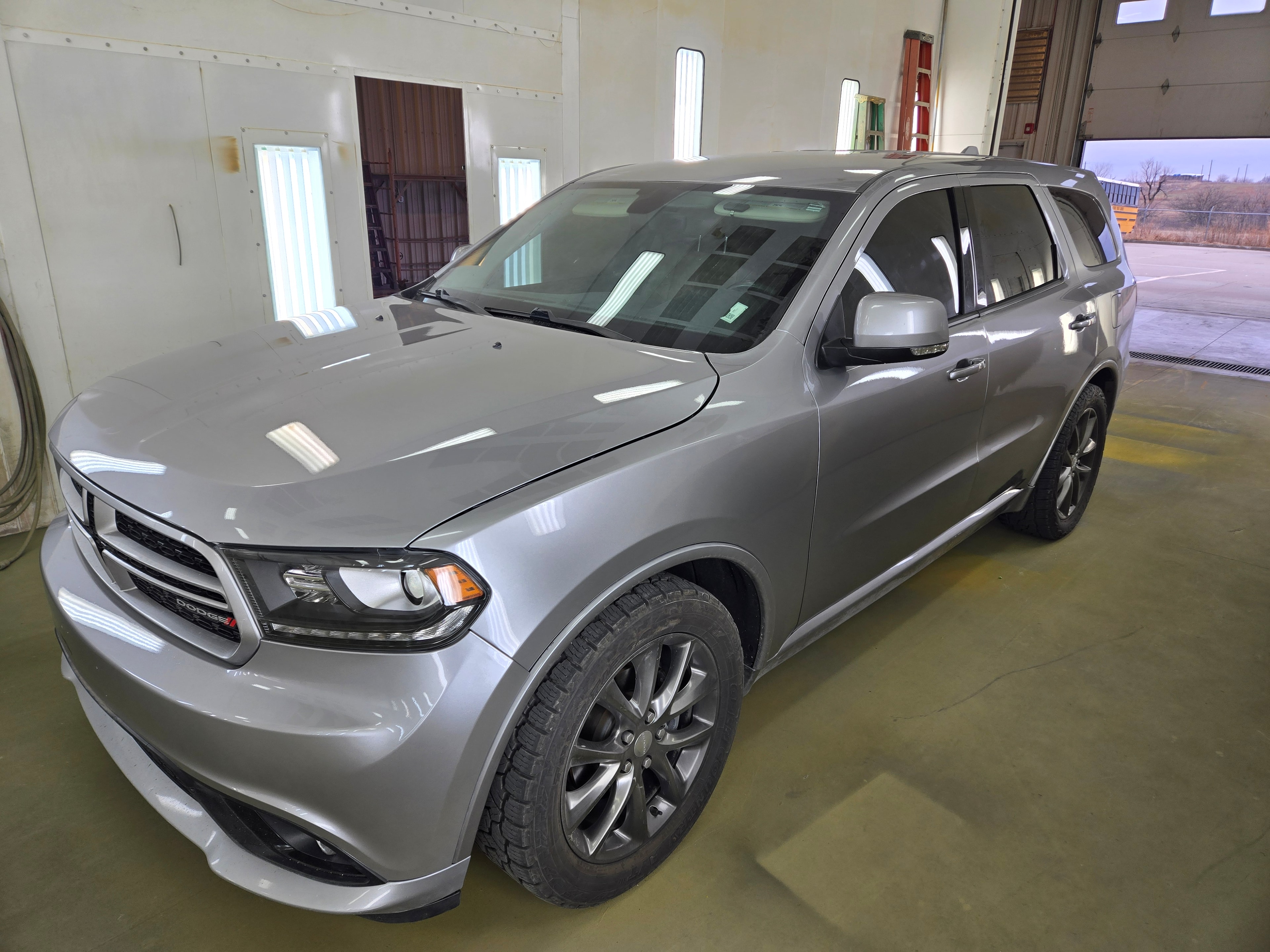 Dent repair — technician working on vehicle